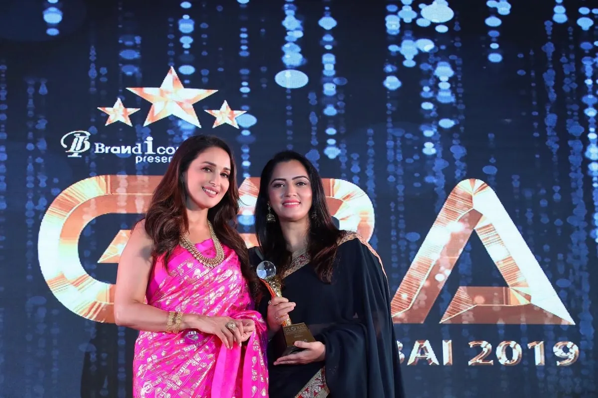Jividha Sharma on stage at an award evening